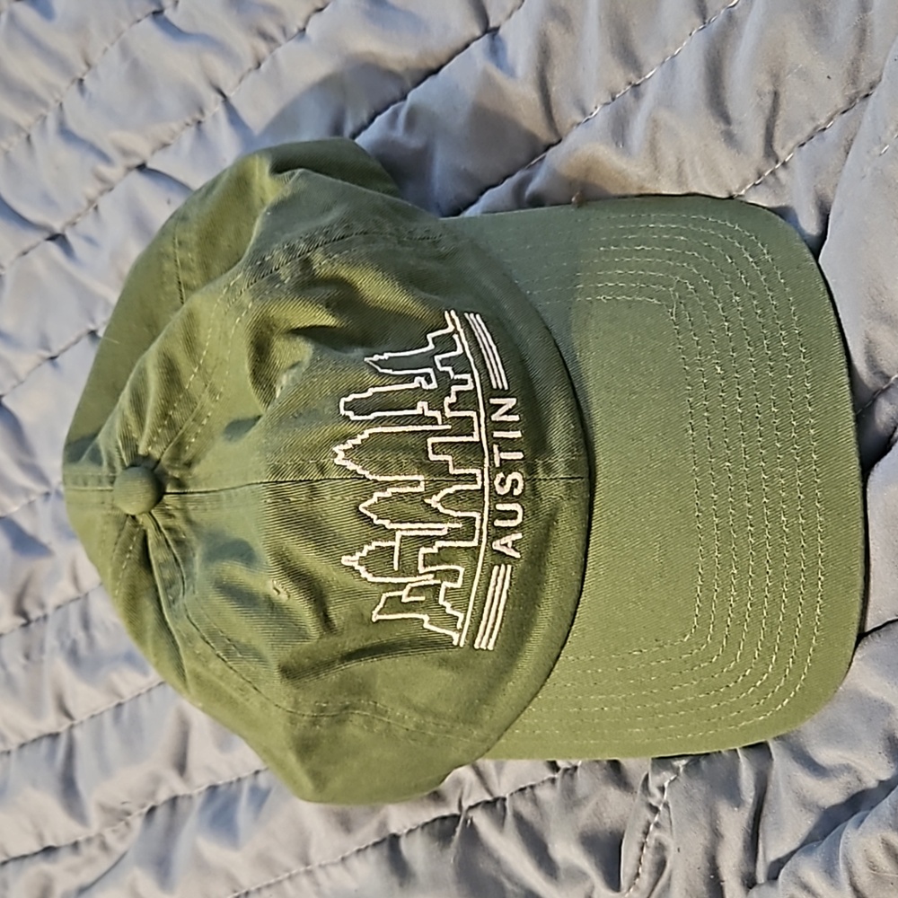 Green ball cap Austin Texas skyline